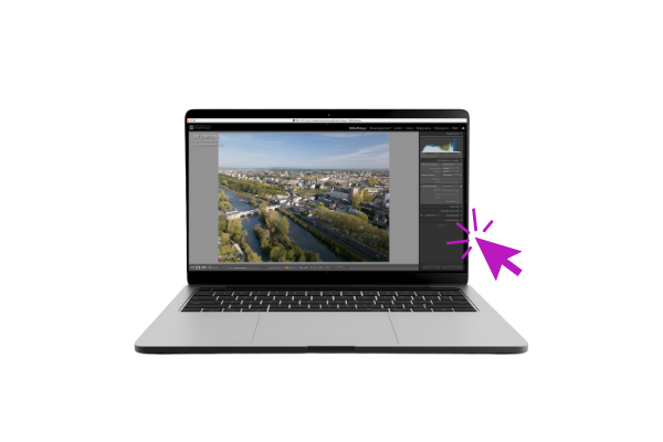 Photo d'un ordinateur ouvert sur le logiciel Lightroom